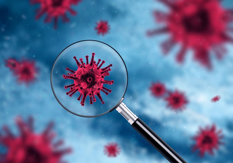 COVID-19 virus under magnifying glass
