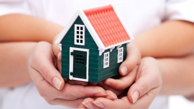 family holding home in their hands representing mortgage stimulus funding