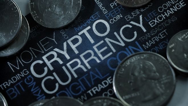 cryptocurrency graphic surrounded by quarters on a dark blue background