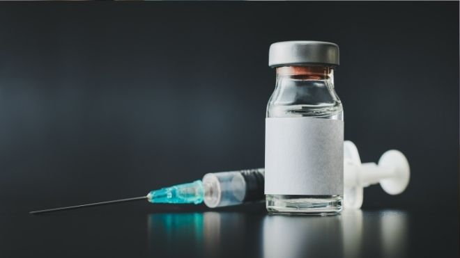 COVID-19 vaccine and syringe- does natural immunity exempt you from vaccine mandates?