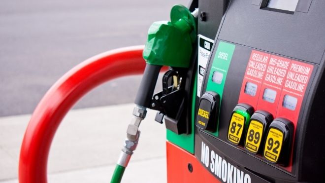 gas pump where prices are rising and residents could see stimulus payments