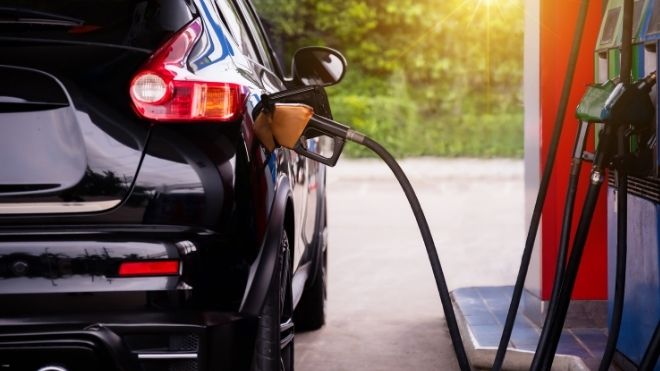 car getting gas as prices rise and states consider gas stimulus payments and tax rebates
