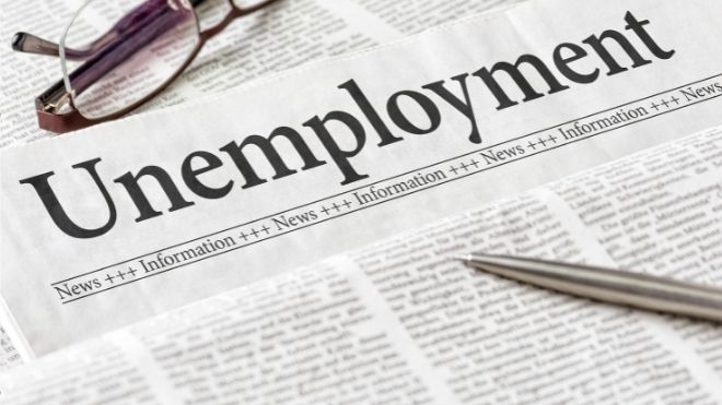 newspaper headline saying unemployment representing benefits