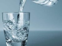Water being poured in glass from pitcher