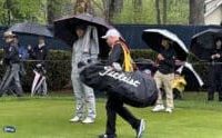 BATTLING THE RAIN: Players struggle as Saturday unfolds at Oak Hill Country Club