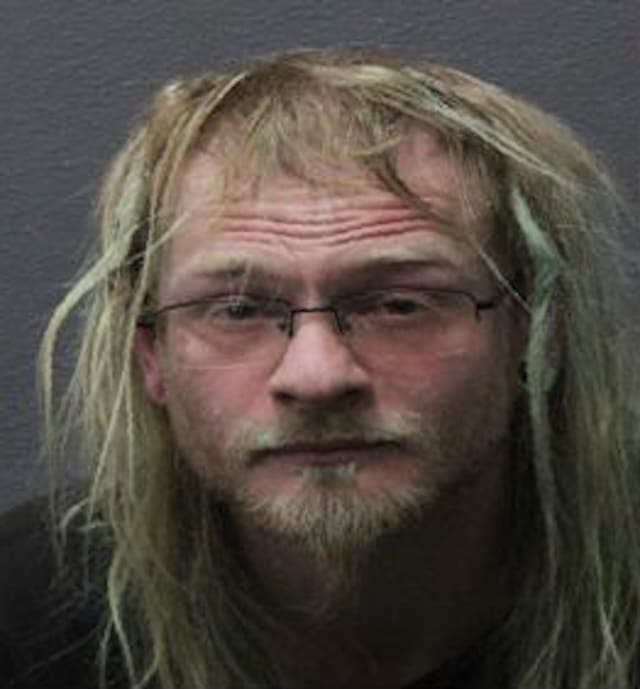 Bath man charged after sidewalk fire, threats, and assault on officer