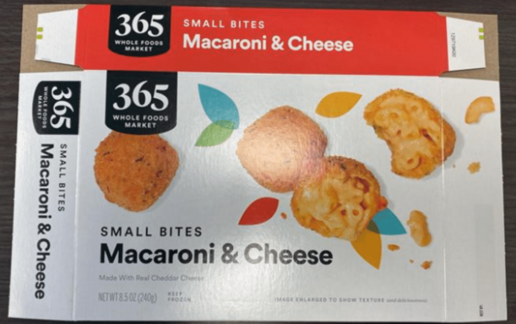 A box of 365 Whole Foods Market Small Bites Macaroni & Cheese, 8.5 oz, with the UPC code 99482499709 and Best-By date 11/29/2025 visible on the packaging