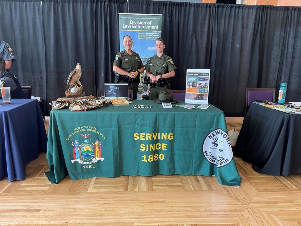 ECOs Bohling (left) and Burgess (right) attend law enforcement career fair at UAlbany