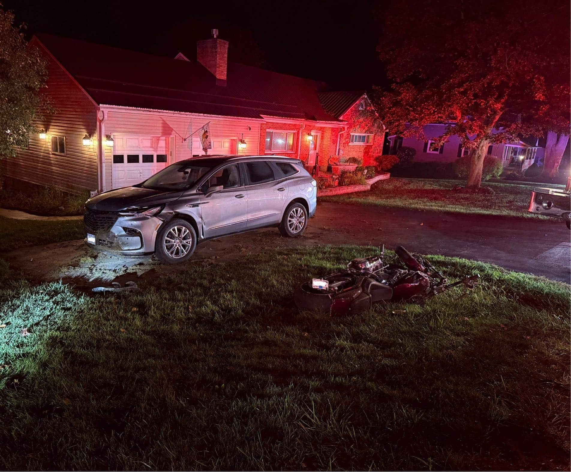 Motorcyclist trapped under vehicle in late-night crash Motorcyclist trapped under vehicle in late-night crash