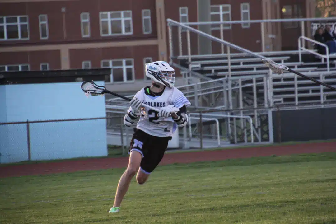 Midlakes standout Nathan Lathrop signs to play lacrosse at Alfred