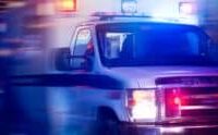 An ambulance responding with emergency lights