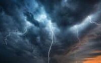 Lightning branches beneath dark storm clouds