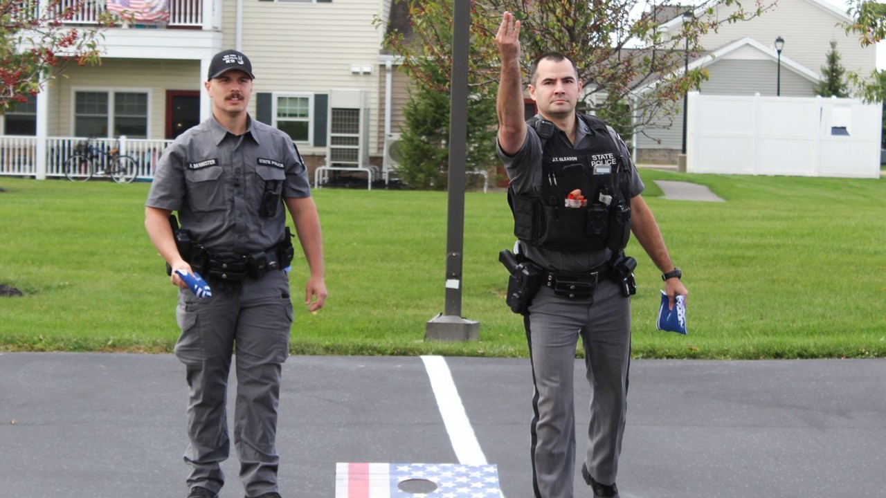 Trolley Station residents team up with first responders for cornhole tournament